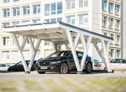 Solar carport with integrated solar panels